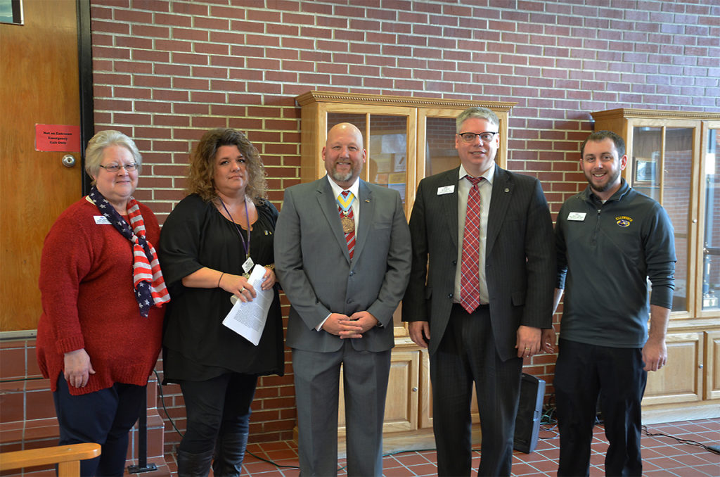ECC celebrates Veterans Day. From left to right, Mary Weaver, Wendy Valentine, CSM (Ret) Robert A. Warrington, Jr., Dr. Martin Reimer, and Maurie Tomke